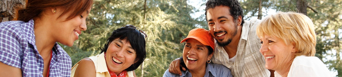 Smiling group of friends enjoy time outdoors
